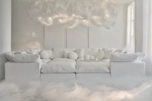 Salon minimaliste entièrement blanc avec un grand canapé blanc surmonté d'un nuage artificiel lumineux suspendu, créant une atmosphère onirique et épurée.